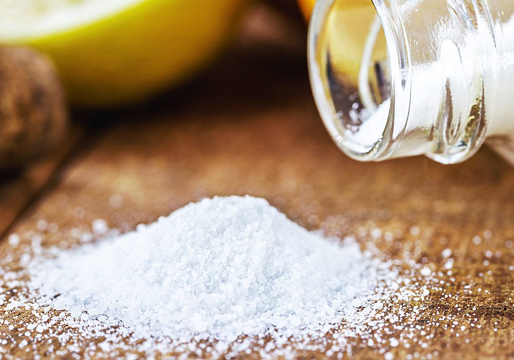 glass-baking-soda-with-citrus-fruits-around-like-lemon-orange-home-remedy-macro-photography