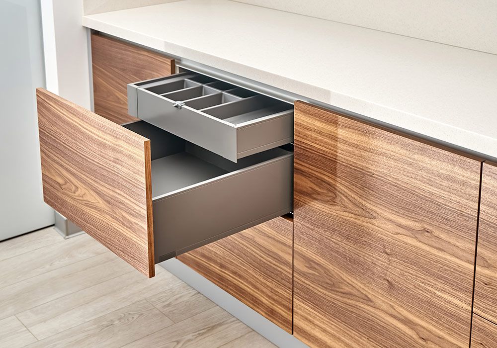 open-drawers-with-cutlery-tray-kitchen-walnut-wood-with-acrylic-solid-surface-countertop