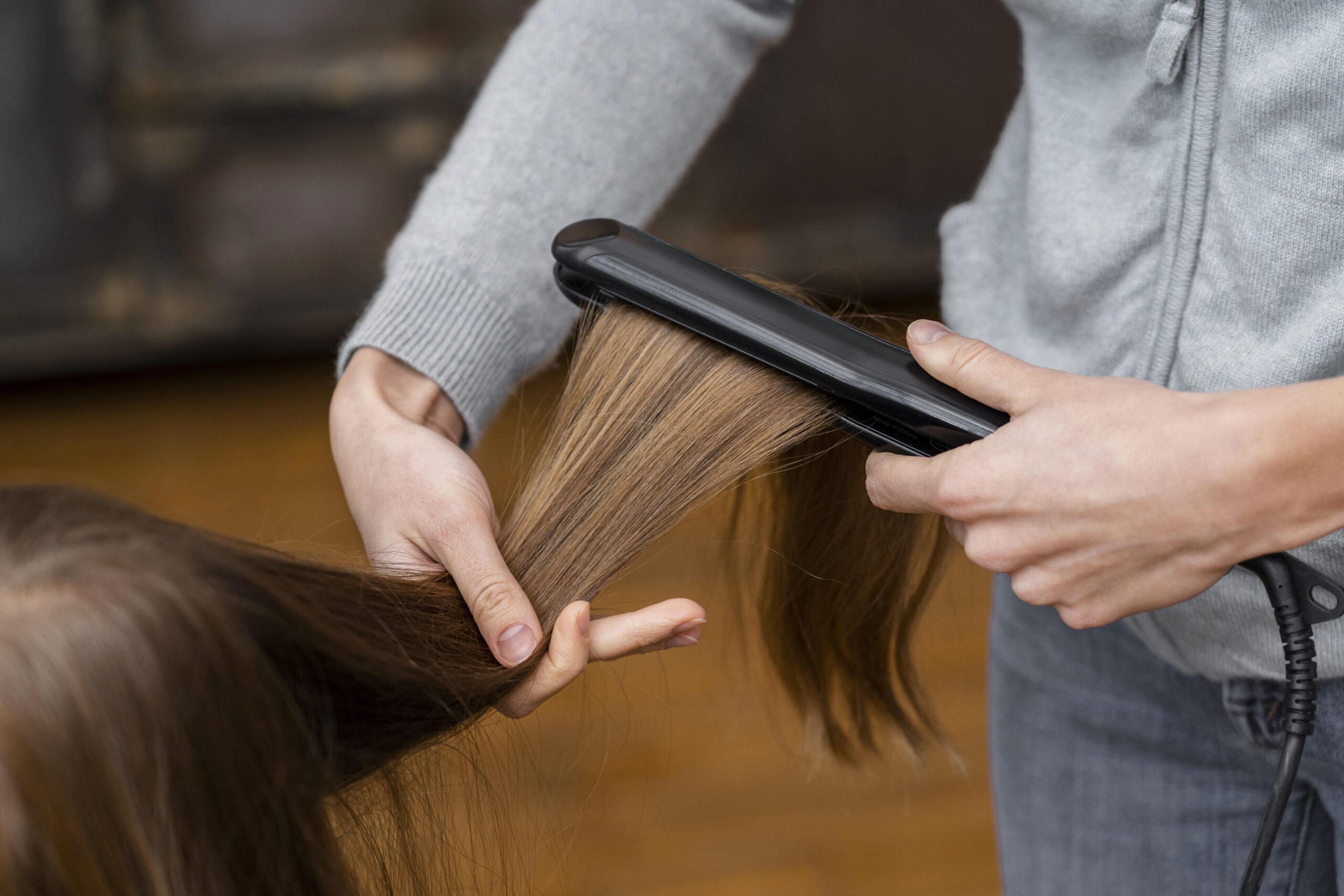 little-girl-getting-her-hair-straightened-min