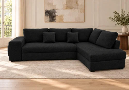 Salon d'angle convertible VIREA en tissu texturé noir, angle à droite, dans un salon lumineux